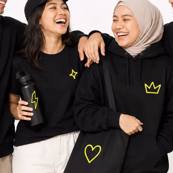 Friends arm in arm in PlayShot merch