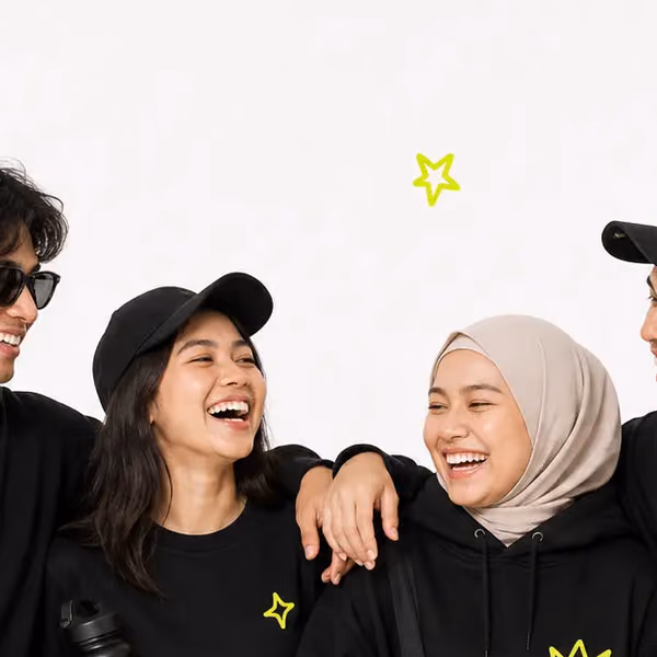 Friends leaning on each other, laughing